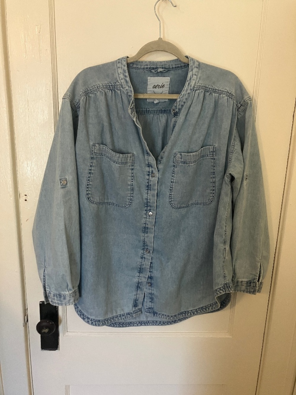 Denim button up collarless  shirt.